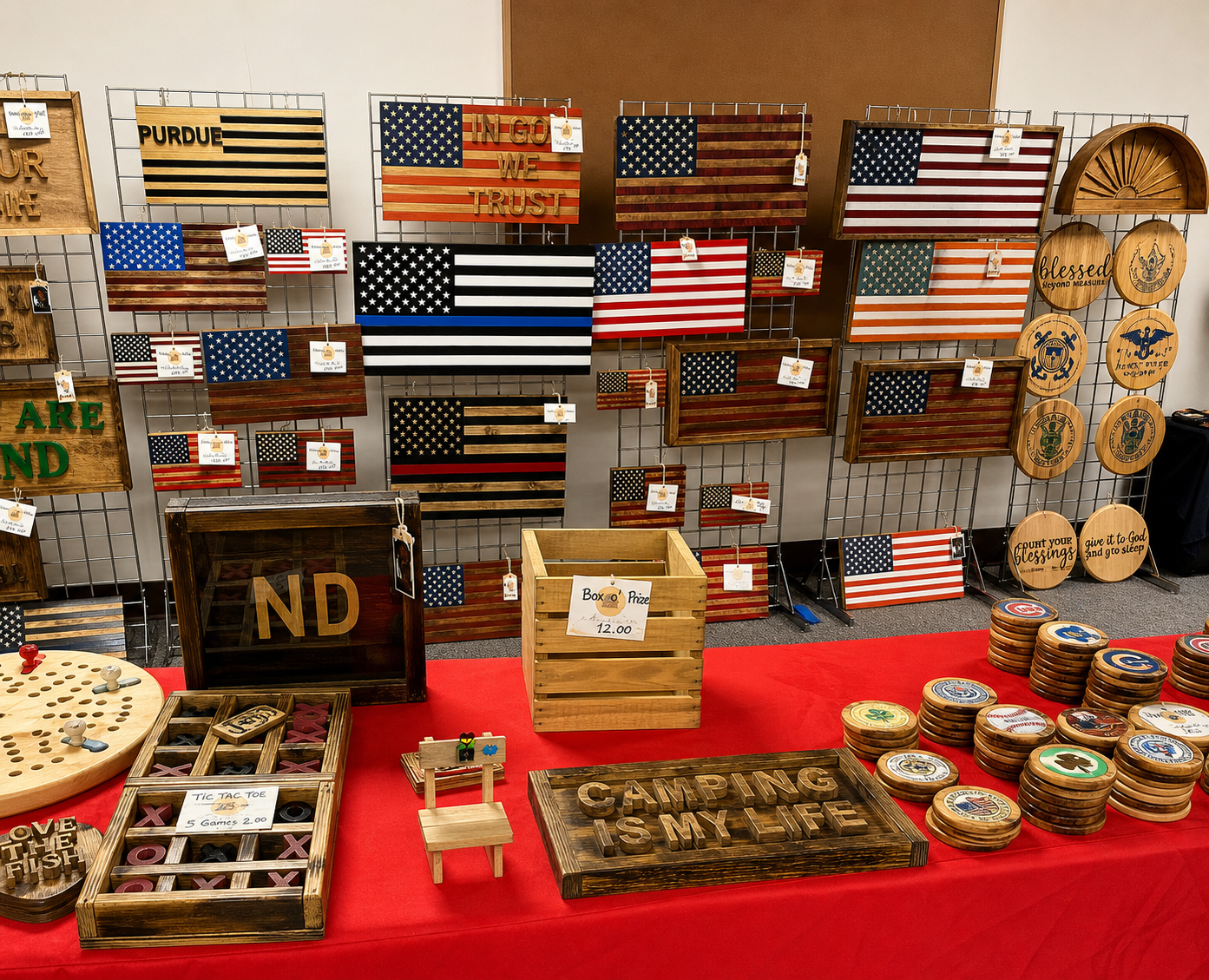 Papa's Woodworking craft show display with handmade patriotic wood pieces